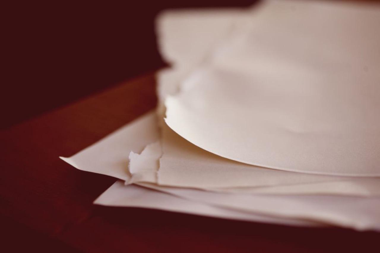 Pile of paperwork on desk - How to clear your name from debt review