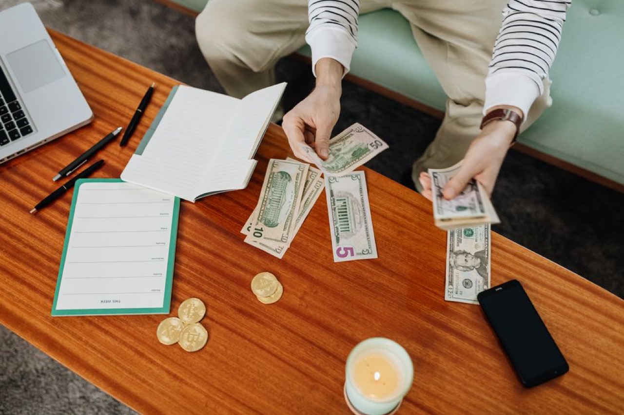 Bills and coins on a table - Debt counsellors in Cape Town