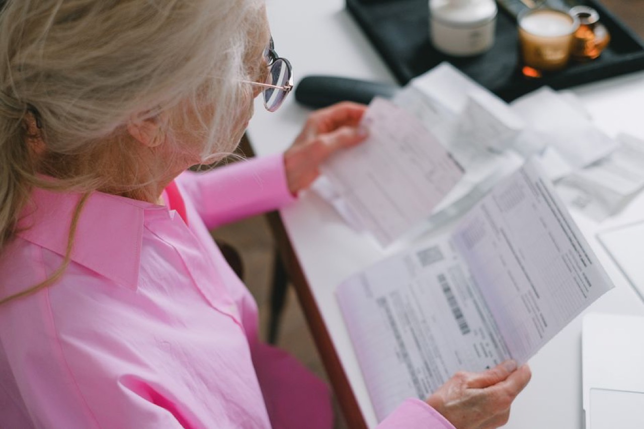 Person reviewing bills at desk - Debt counsellors in Johannesburg