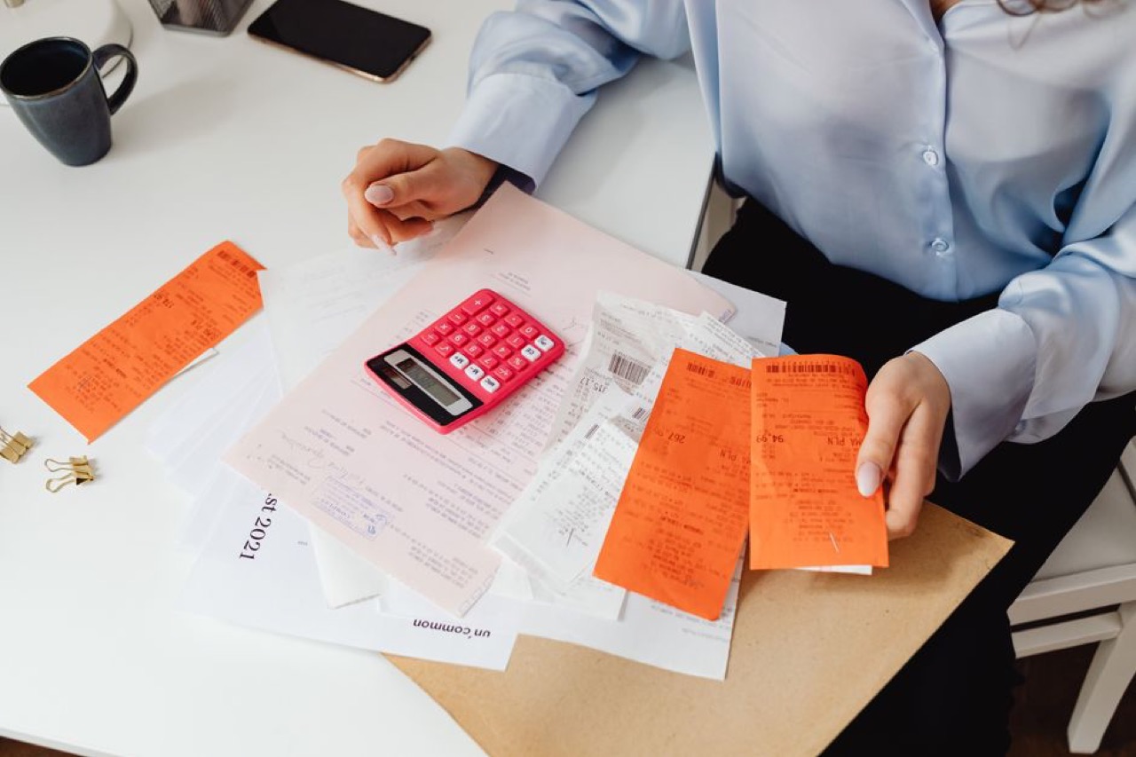 Person reviewing bills at desk - Debt counsellors in Pretoria