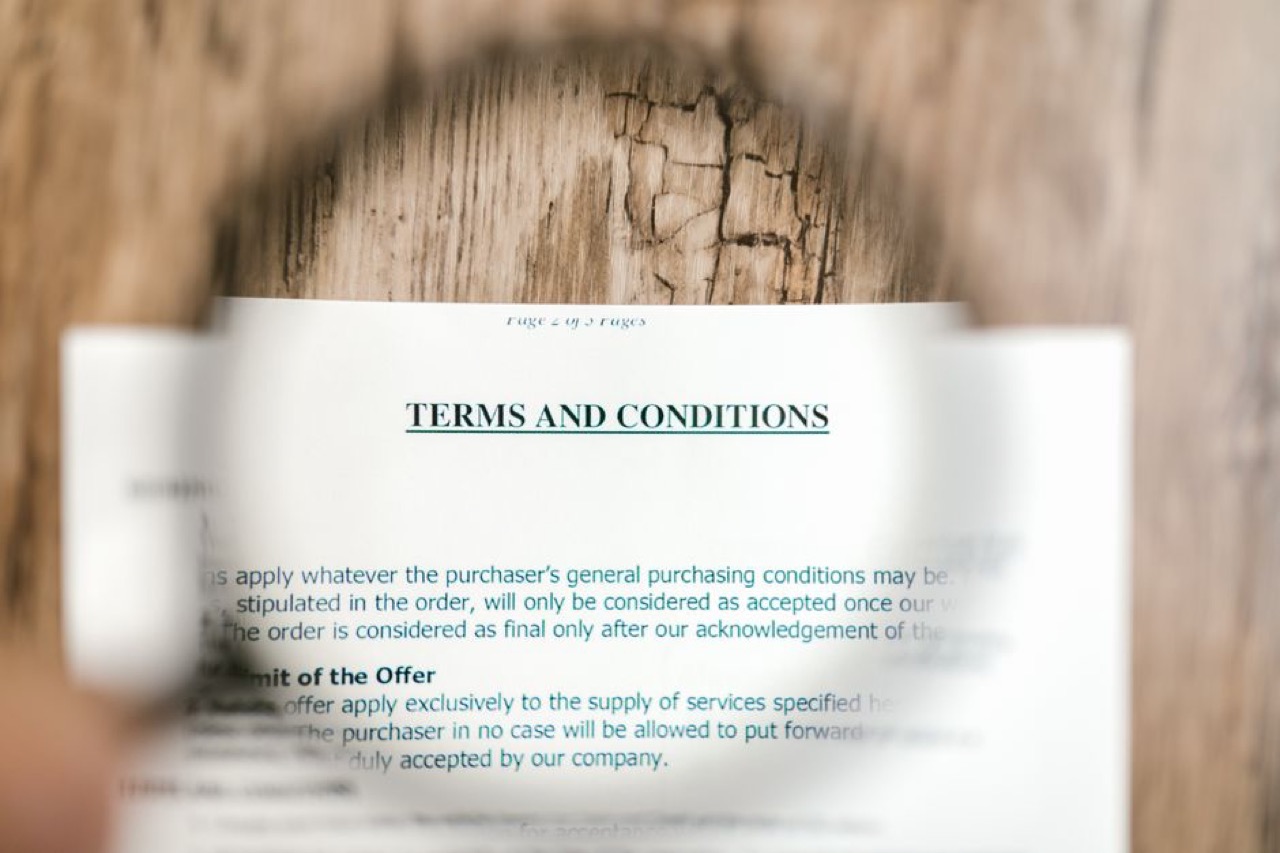 Reviewing contract with magnifying glass - Debt restructuring explained