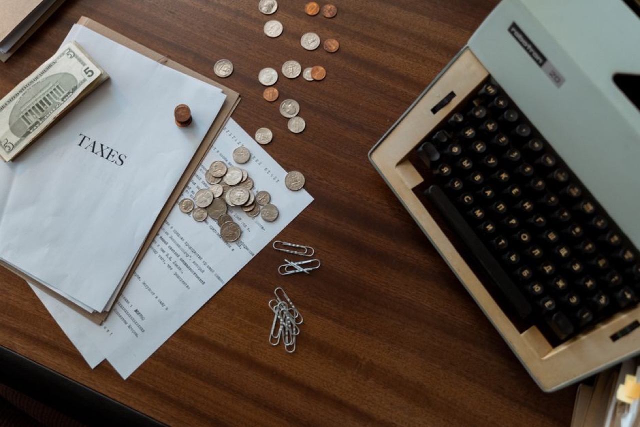 Bills and coins on a table - Debt review and your credit record