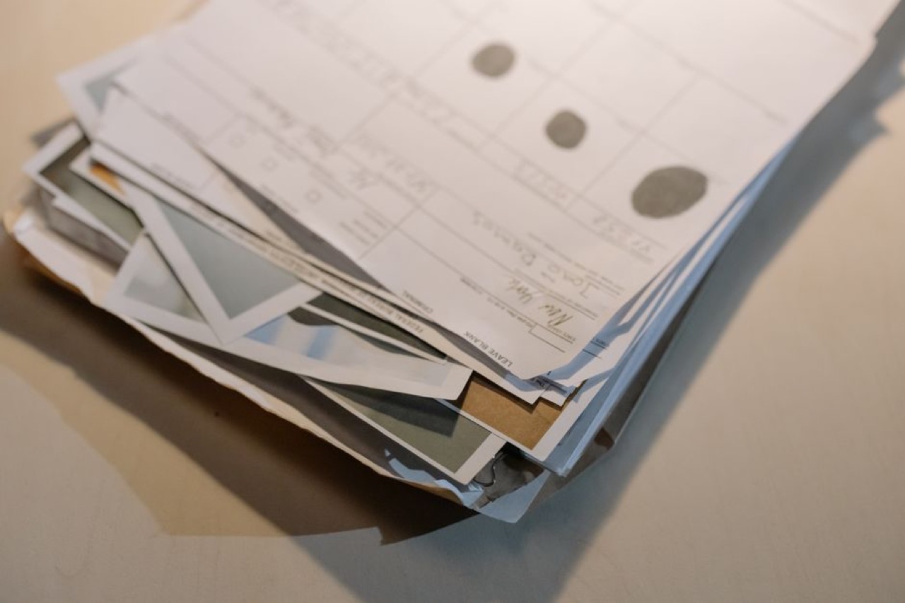 Pile of paperwork on desk - Debt review clearance certificate (Form 19) explained