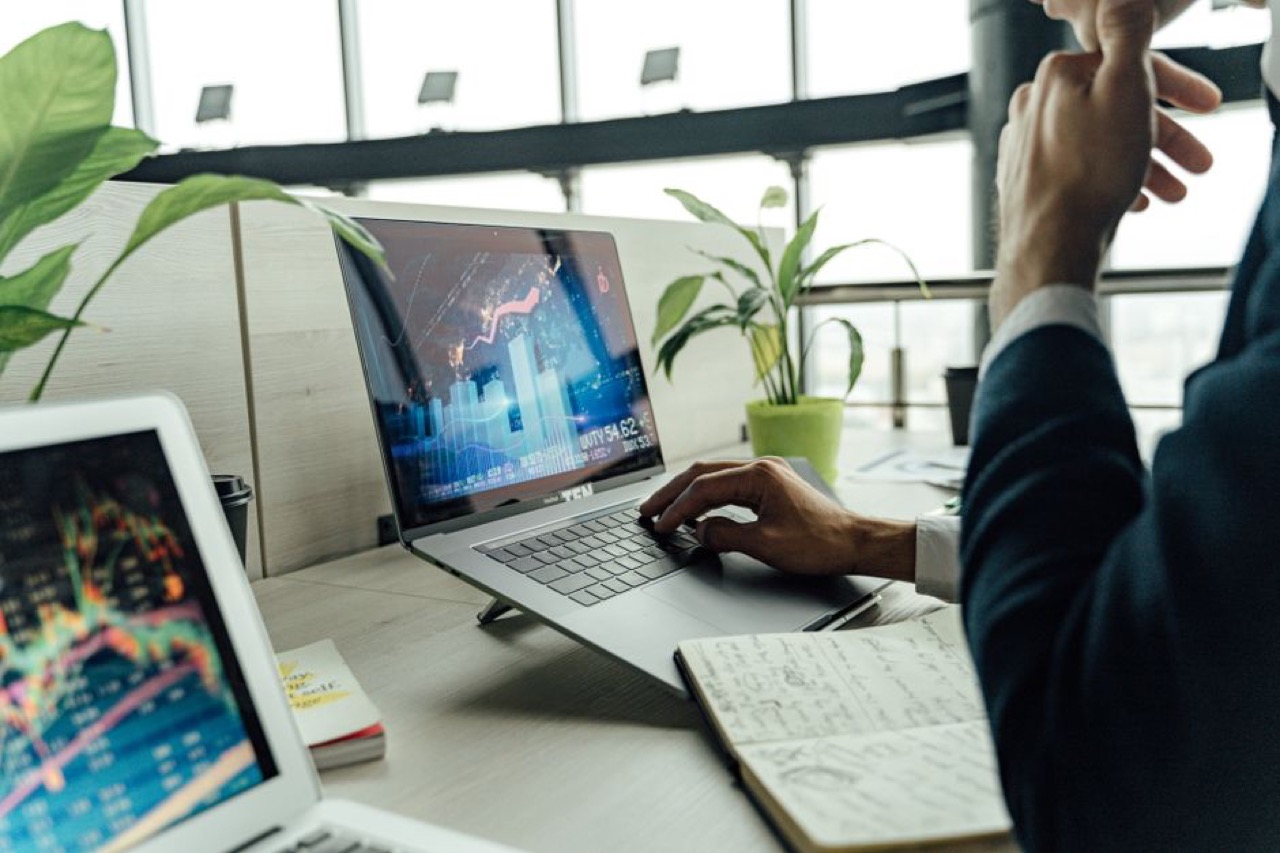 Looking at finances on laptop - The debt review process step by step