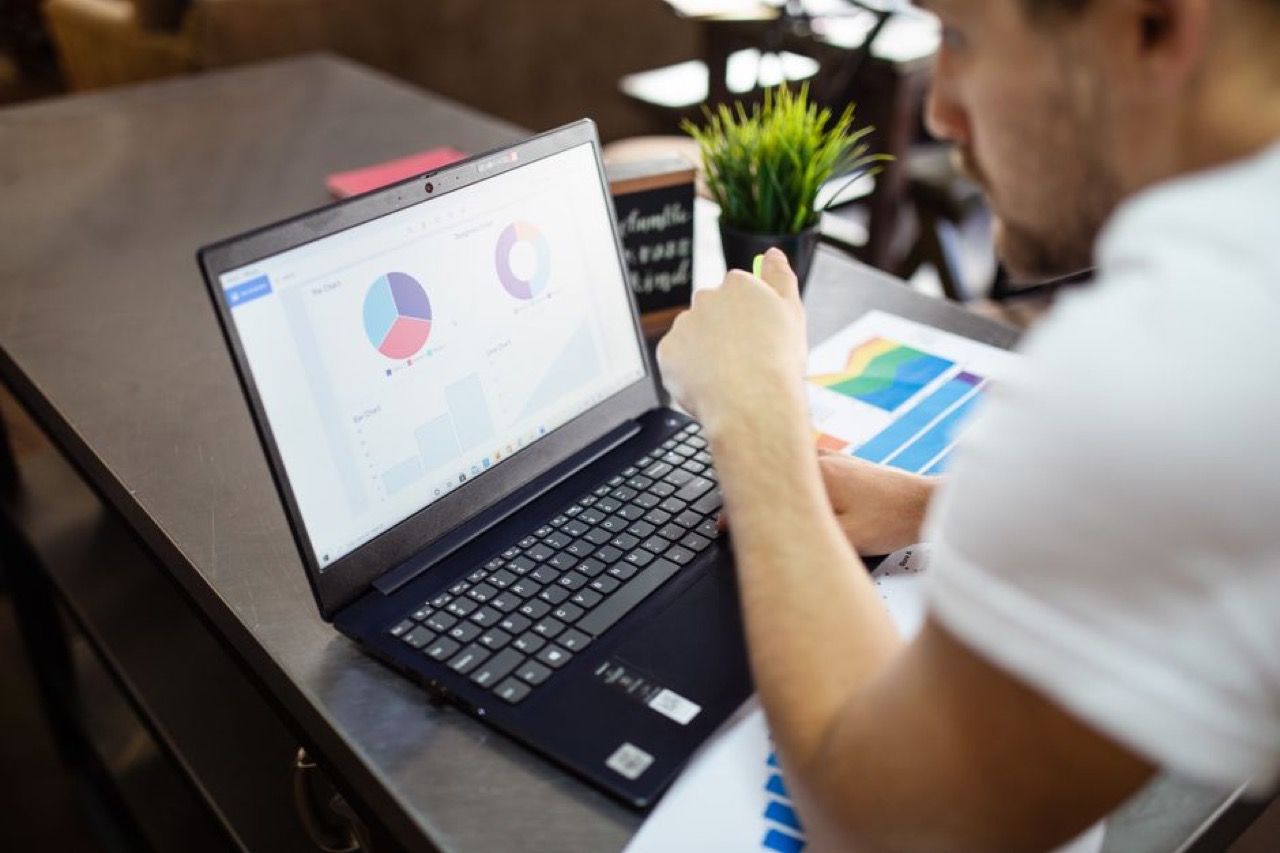 Looking at finances on laptop - Free debt review removal: is it really free?