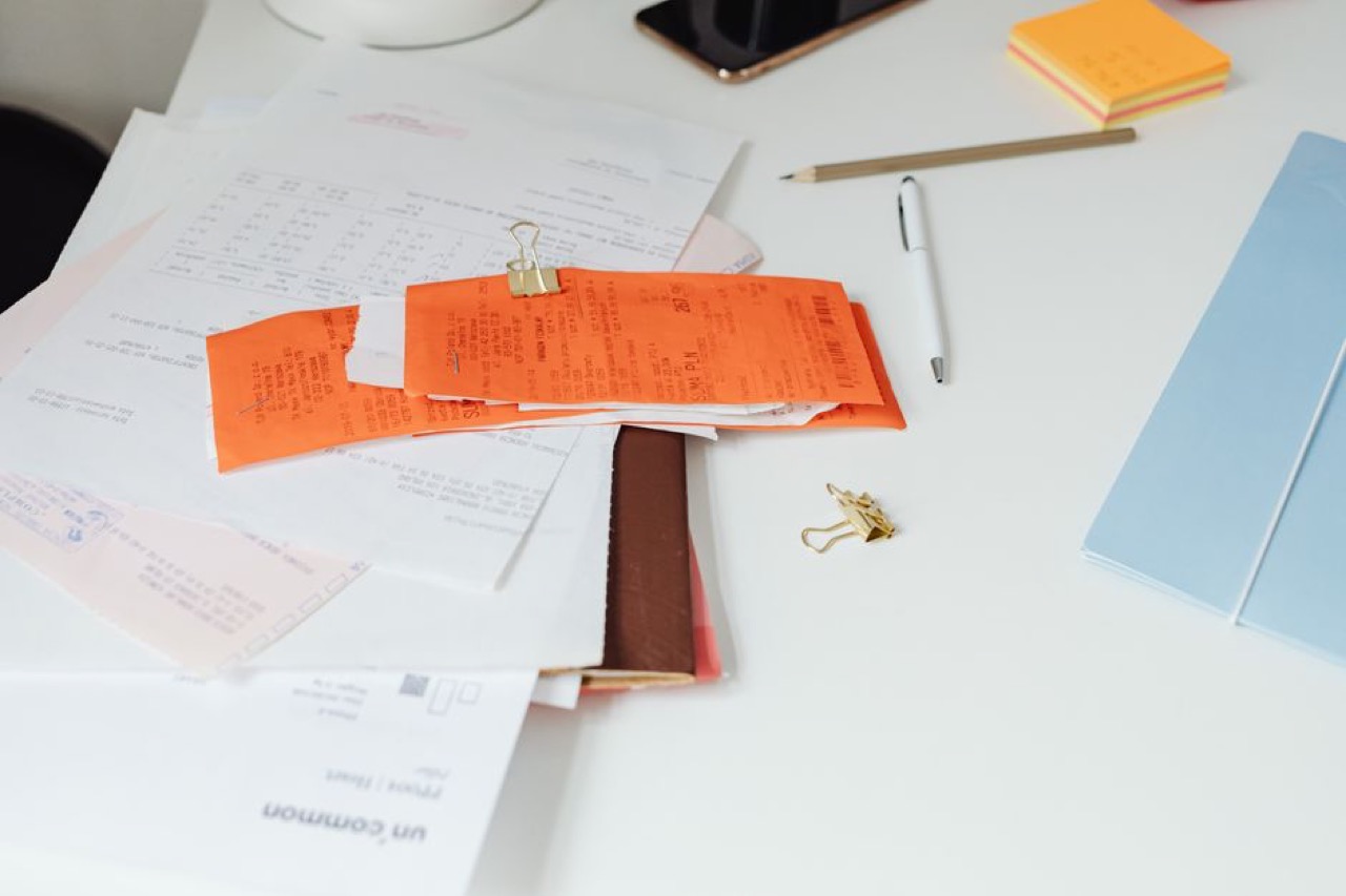 Pile of paperwork on desk - How does debt review work in South Africa?