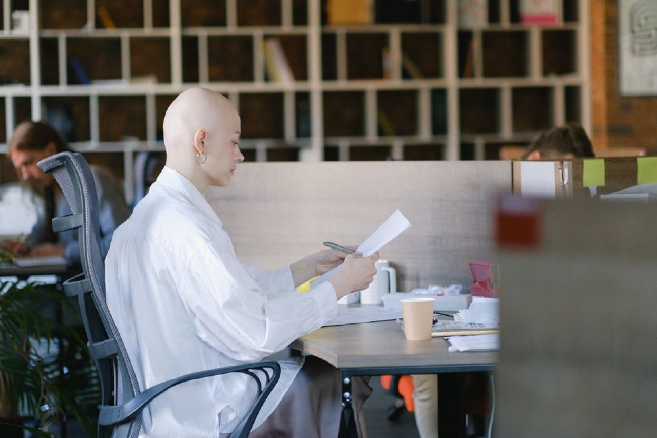 Thinking at desk with documents - Is debt review a good idea?