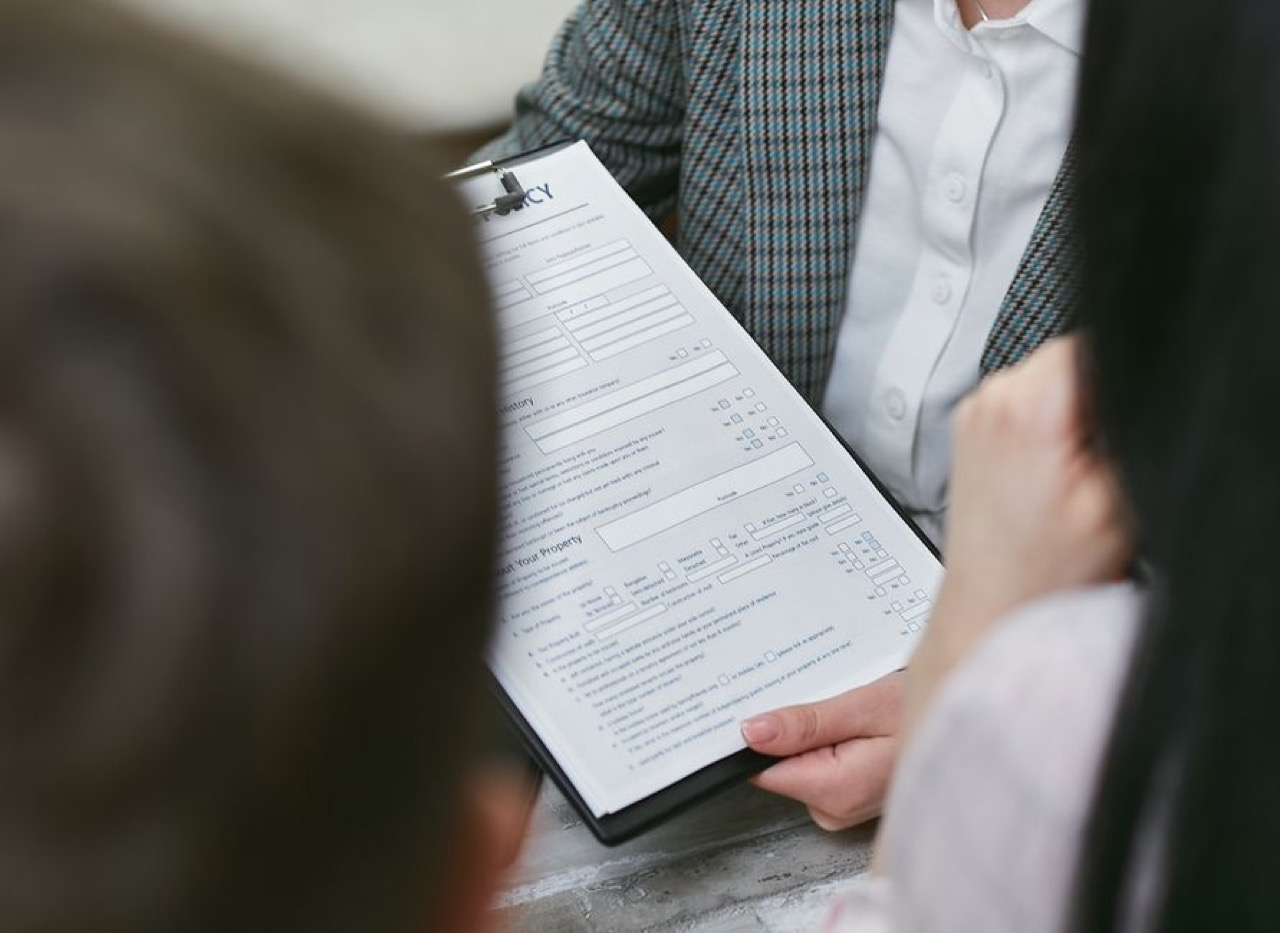 Advisor pointing at form - The National Credit Act (NCA) explained