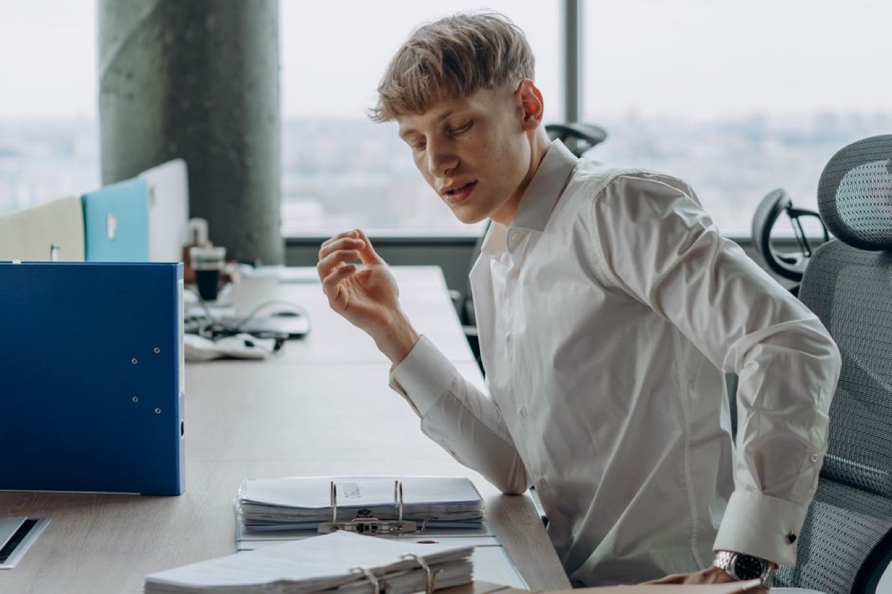 Thinking at desk with documents - What is debt counselling?