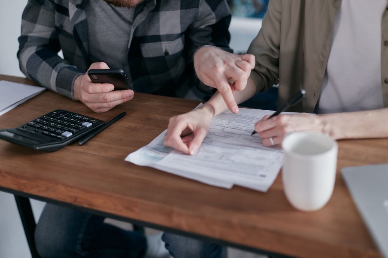 Couple reviewing finances together - Best debt review companies in South Africa
