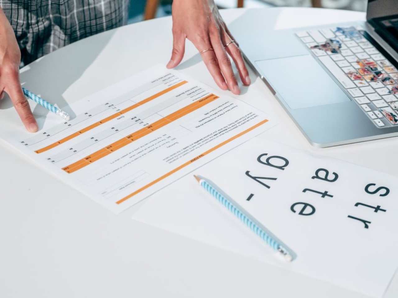 Laptop and documents on desk - Letter to cancel debt review (template)