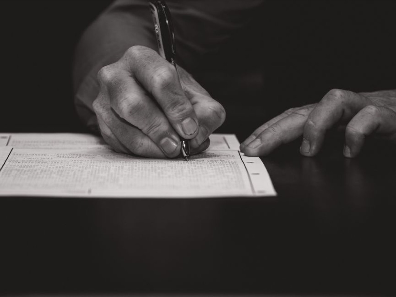 Filling in a form with pen - Debt review removal request letter (template)