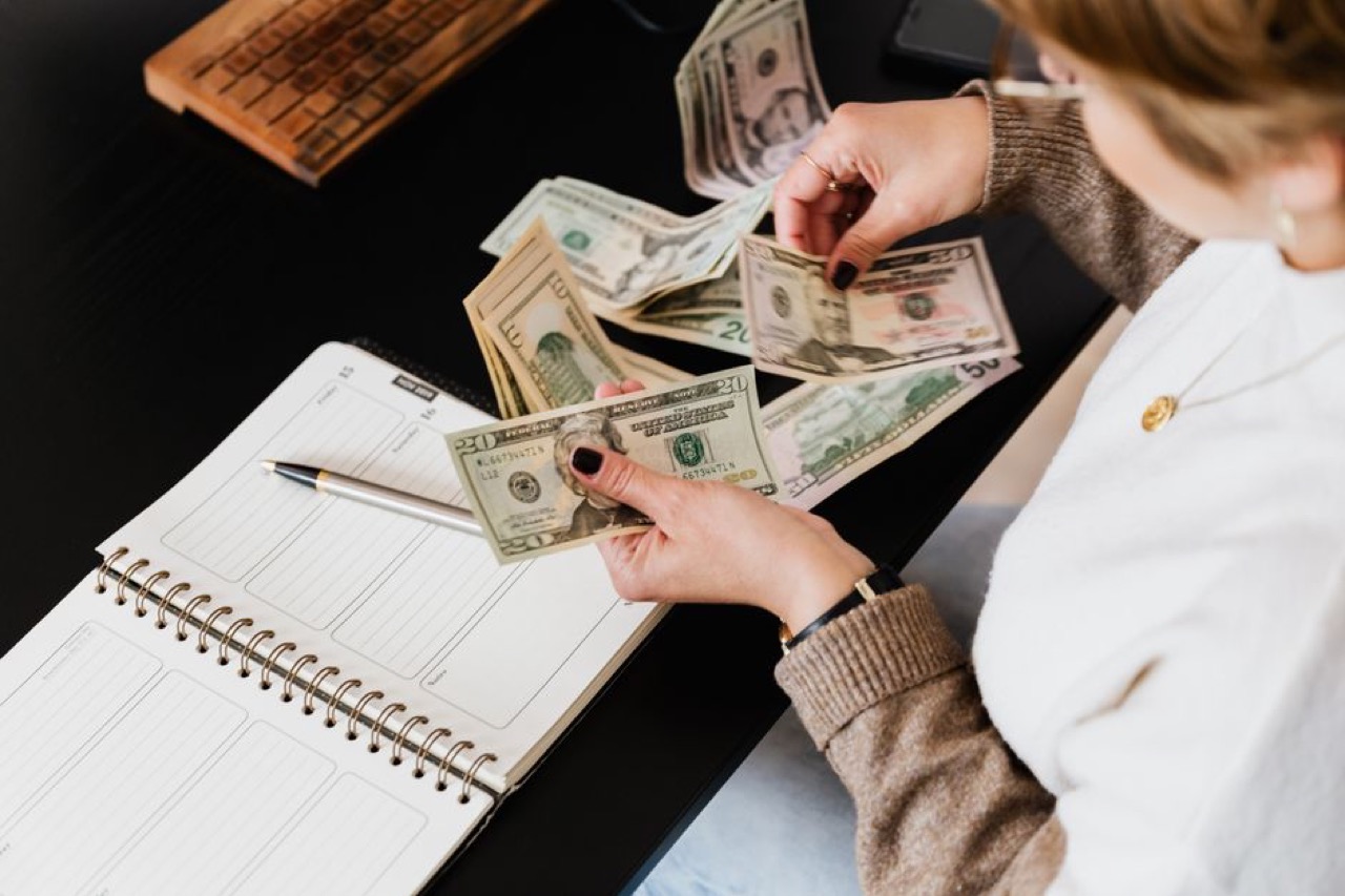 Budget planning on desk - Debt snowball vs avalanche tracker (template)