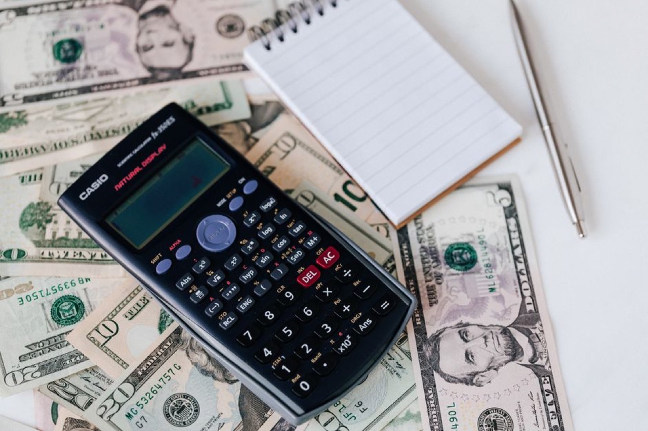 Calculator and money - Household budget worksheet