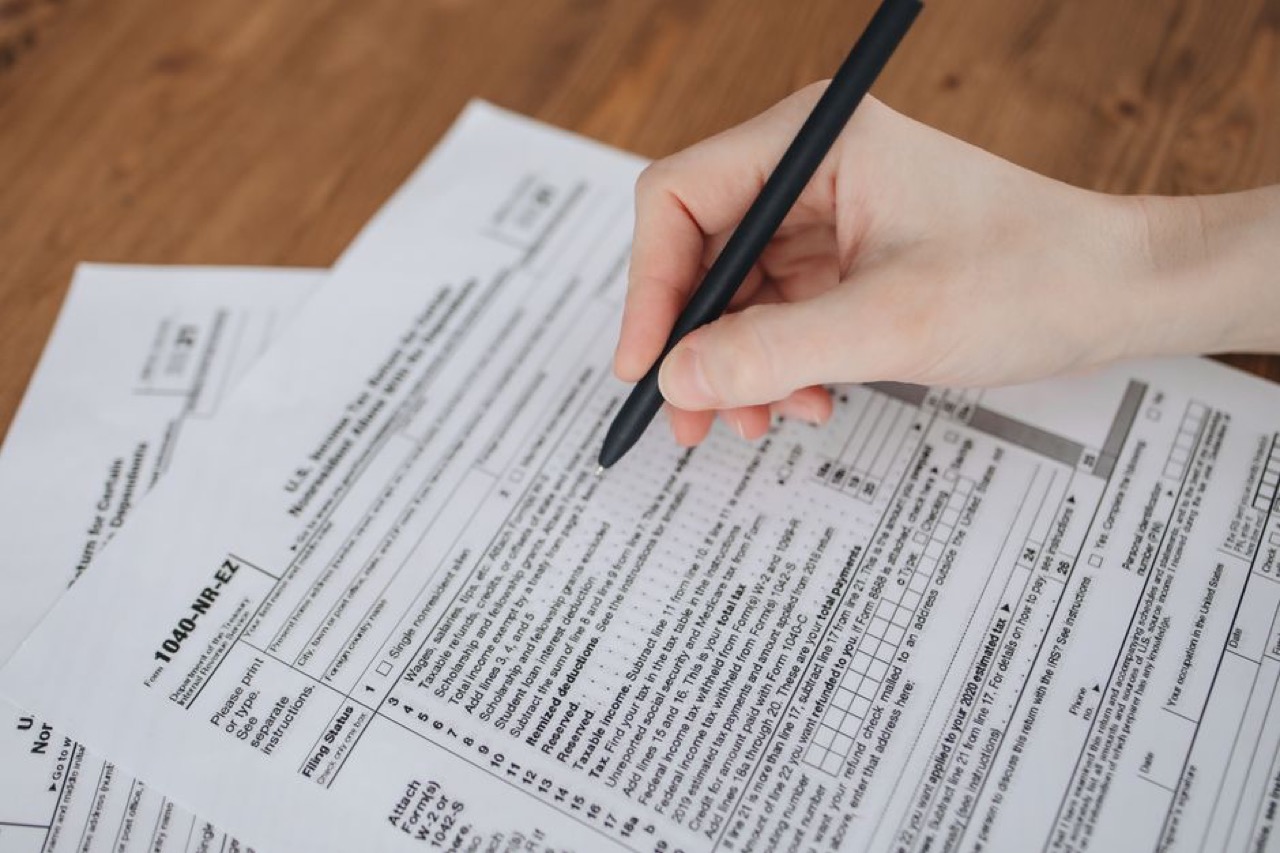Filling in a form with pen - Prescribed debt dispute letter (template)