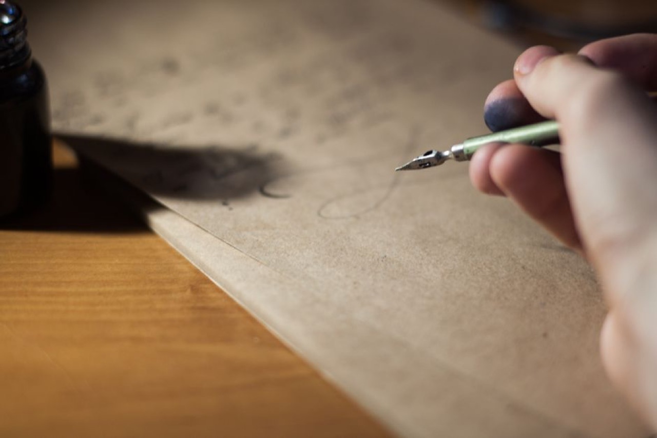 Writing a letter at desk - Request your debt review clearance certificate (template)