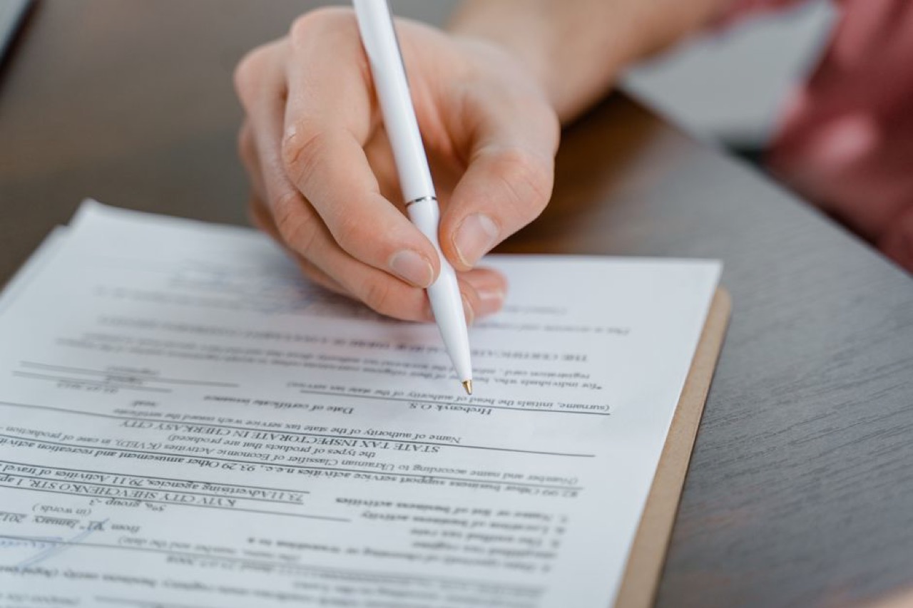 Filling in a form with pen - How to respond to a section 129 letter of demand (template)